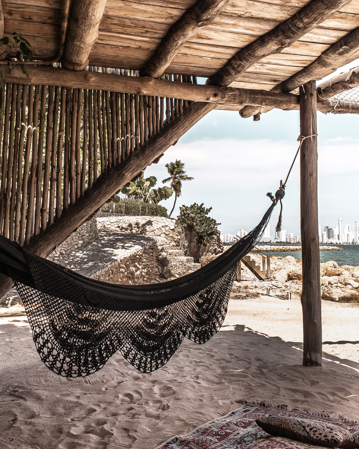 Bohemian fringe hammock at the beach lounge at Eteka Beach Hotel - Cartagena, Colombia