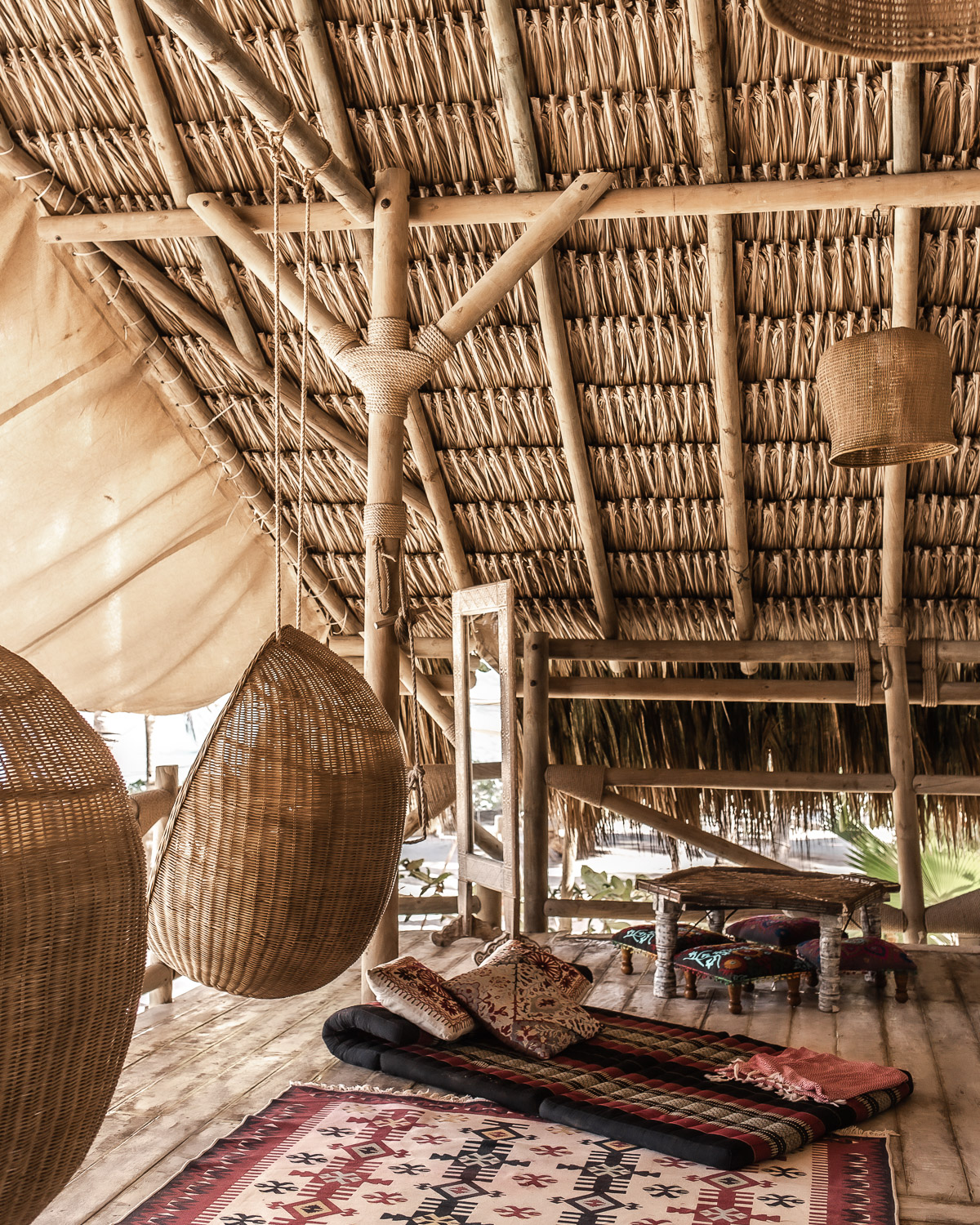 Rattan nest hammocks featured on the deck above the lobby at Eteka Beach Lounge & Hotel - Cartagena, Colombia