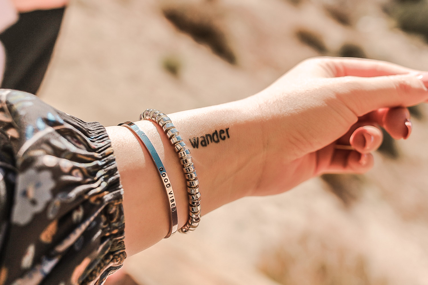 Mantraband product closeup shot by Wanderfully Rylie. Bracelet says "good vibes".