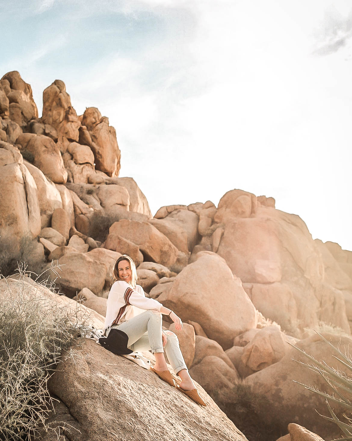 Rylie sitting on a rock near Ryan Mountain in Joshua Tree National Park.