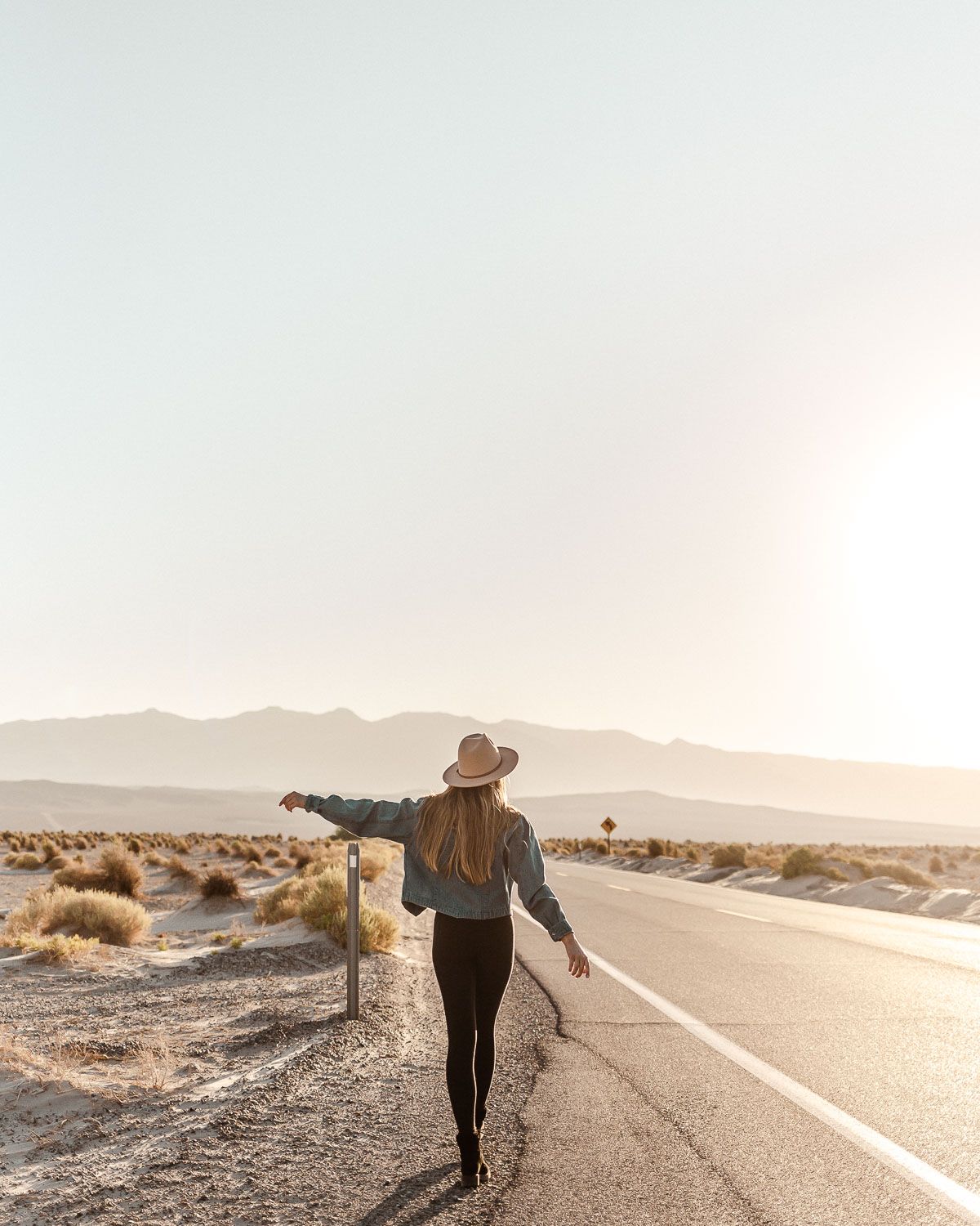 Travel bloggers camera gear · Using the best travel camera and photography gear for bloggers to capture photos like this one - Pictured: Me in the desert in Death Valley National Park, California.
