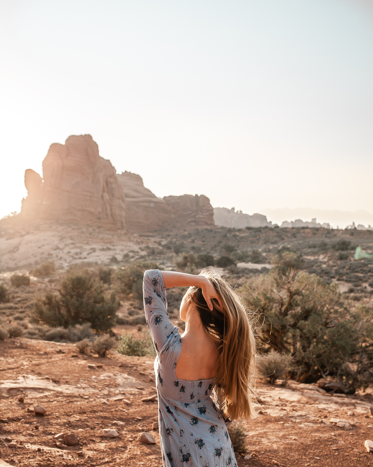 Catching the sunrise rays at one of the best hikes in Arches National Park, Utah (pictured near the trail for Balanced Rock).